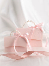 Load image into Gallery viewer, Custom Elegant Embossed Wedding Favor Boxes – Pearl Handle Gift Bags with Ribbon & Optional Tags